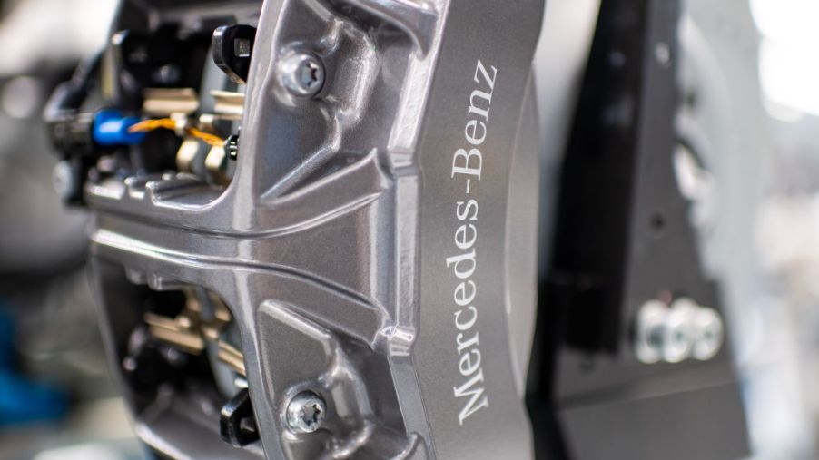 A close-up of a silver Mercedes-Benz brake caliper