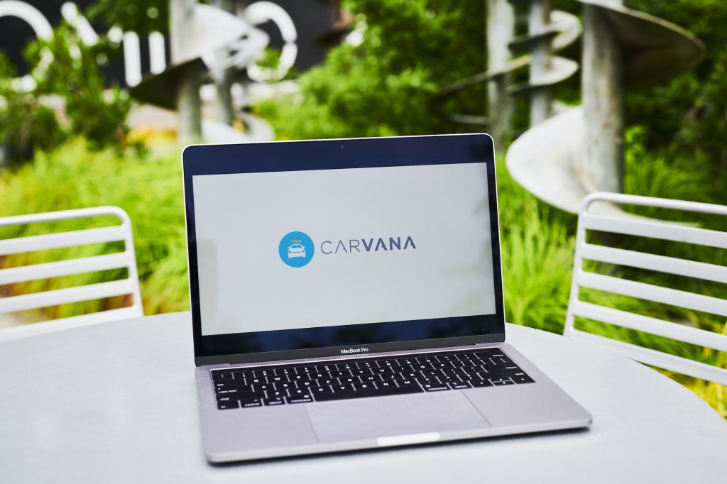 A laptop showing the Carvana logo