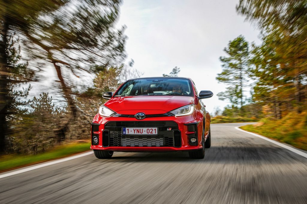 An image of a red 2021 Toyota GR Yaris out on the road.