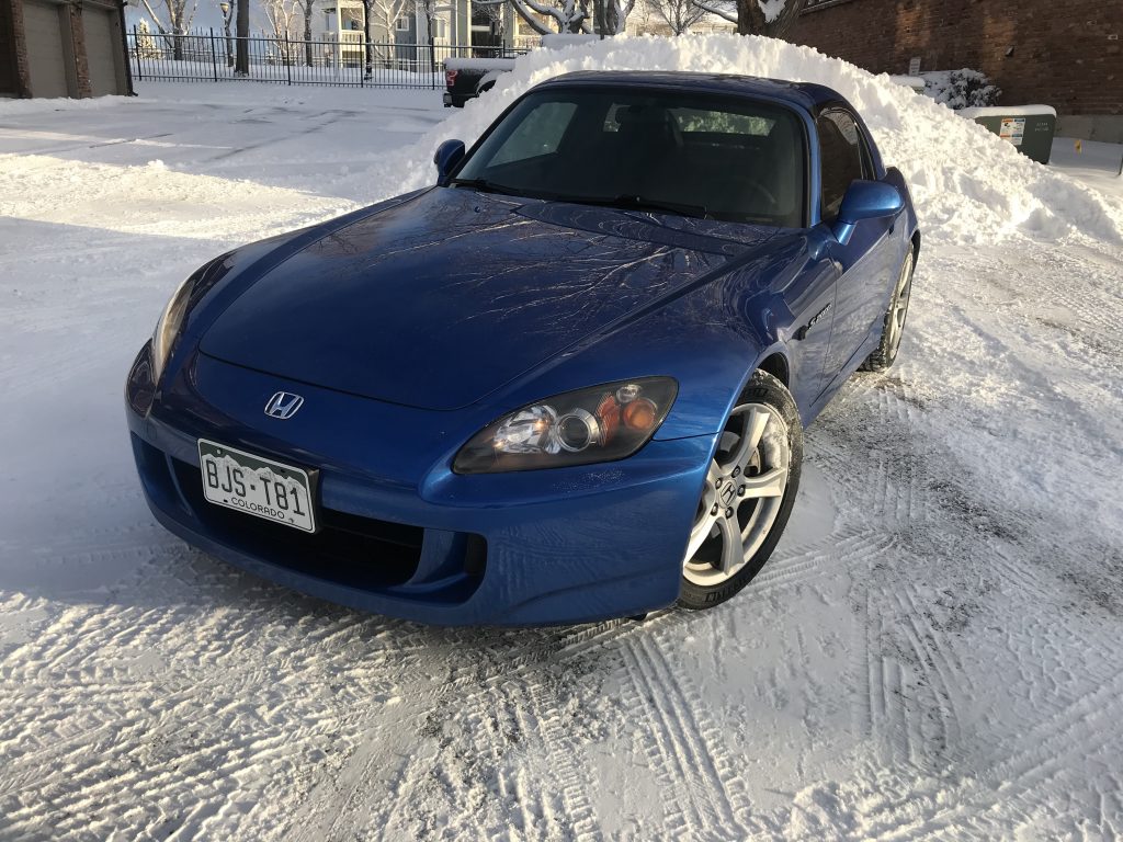 Michelin Pilot Sport All Season tires on a Honda S2000. A front shot of the car in the snow.