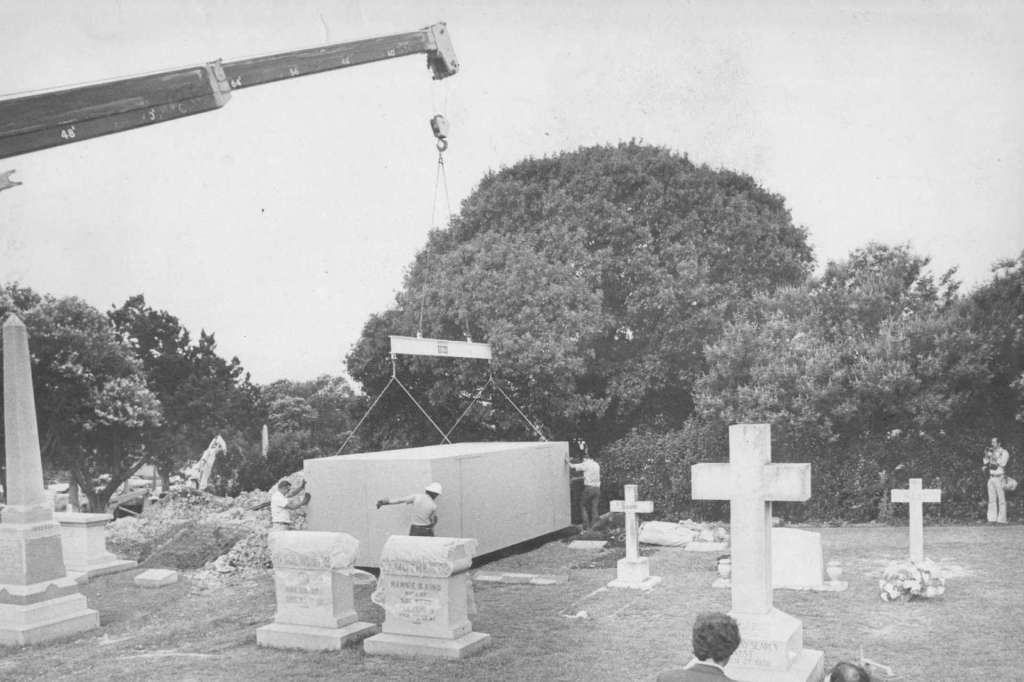 An image of a grave dug out to feature a Ferrari 330 America and its owner.