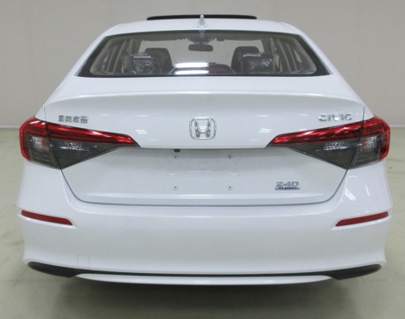 An image of a white 2022 Honda Civic ahead of its global debut.