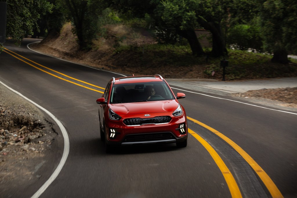 2021 Kia Niro driving down an empty road
