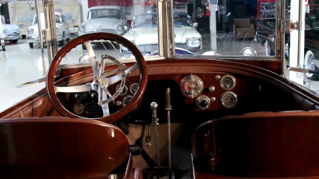 The brown-leather front seats and mahogany-and-teak dashboard of Jay Leno's 1916 Crane-Simplex Holbrook Skiff