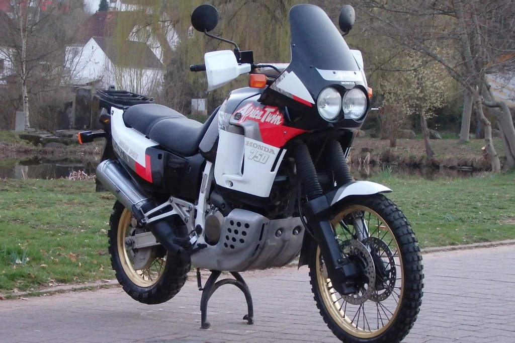 A white-red-and-black 1991 Honda Africa Twin XRV750 RD04 on a driveway
