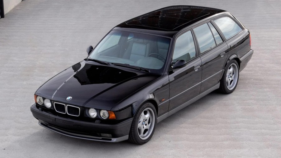 An overhead-angle view of a black 1992 BMW M5 Touring in a parking lot