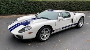 A white 2005 ford gt with blue stripes