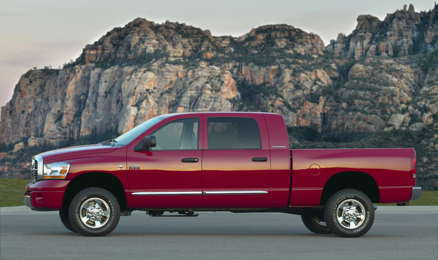 A red 2008 Dodge Ram diesel pickup with a manual transmission