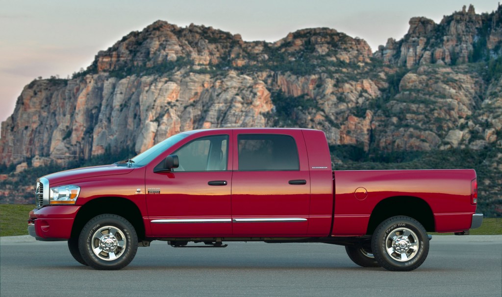 A red 2008 Dodge Ram diesel pickup with a manual transmission