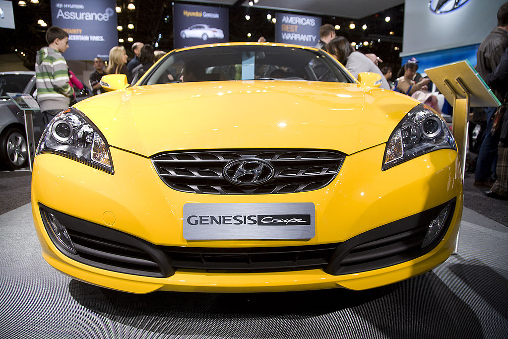 A yellow 2009 Hyundai Genesis Coupe on display