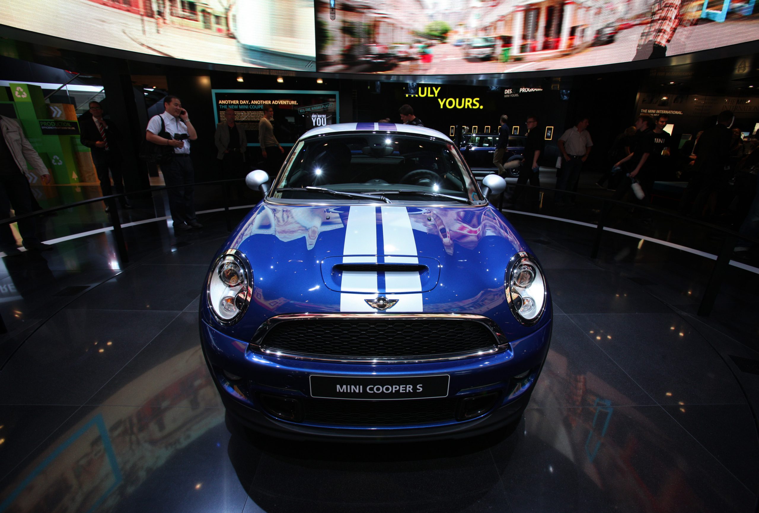 A blue and white 2011 Mini Cooper S on display