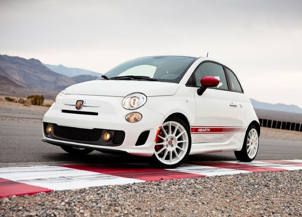 A white-and-red 2012 Fiat 500 Abarth on a racetrack