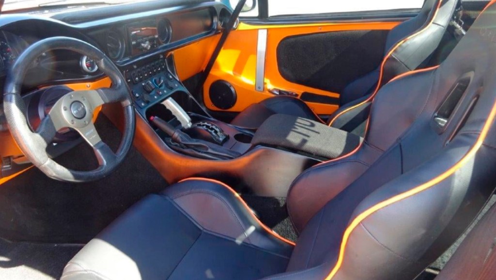 The front interior of a 2012 Local Motors Rally Fighter with optional leather seats and audio system
