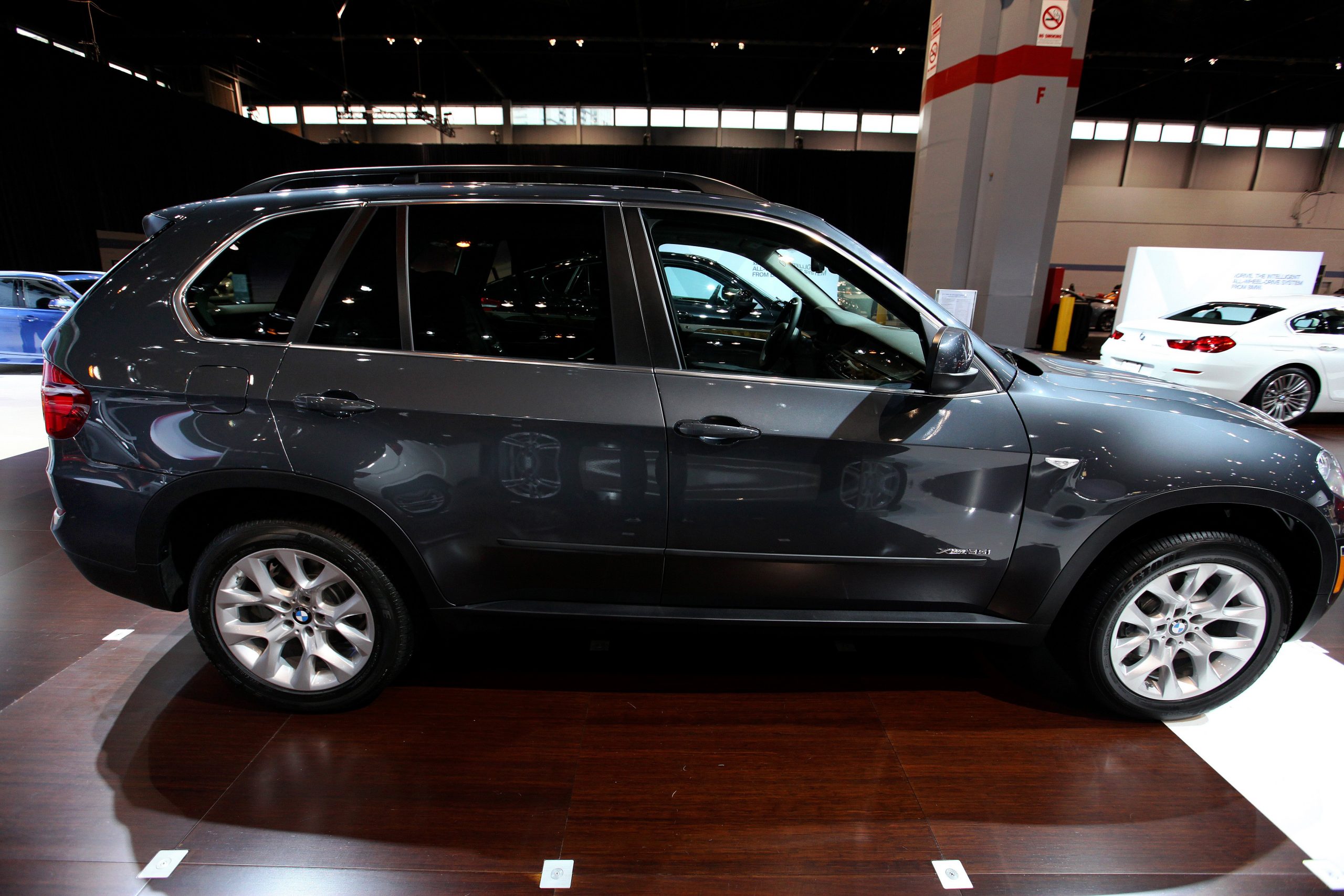 A black 2014 BMW X5 on display at an auto show