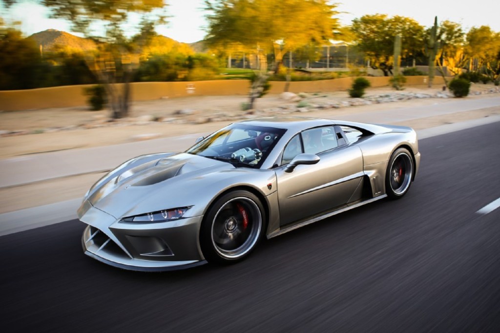A silver 2014 Falcon F7 drives down an Arizona road