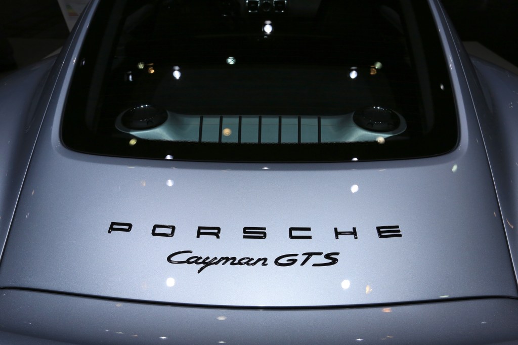 The rear window of a silver 2014 Porsche Cayman GTS