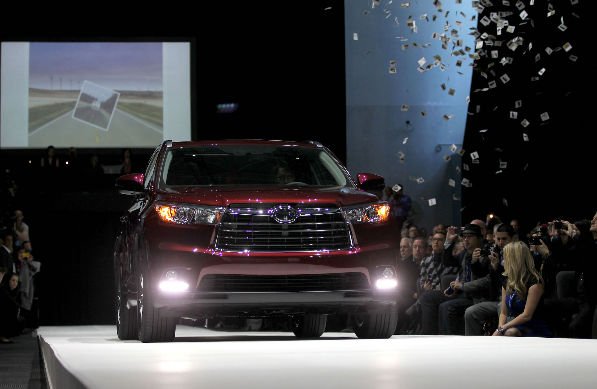 A burgundy 2014 Toyota Highlander midsize crossover SUV is unveiled during the 2013 New York International Auto Show on Wednesday, March 27, 2013