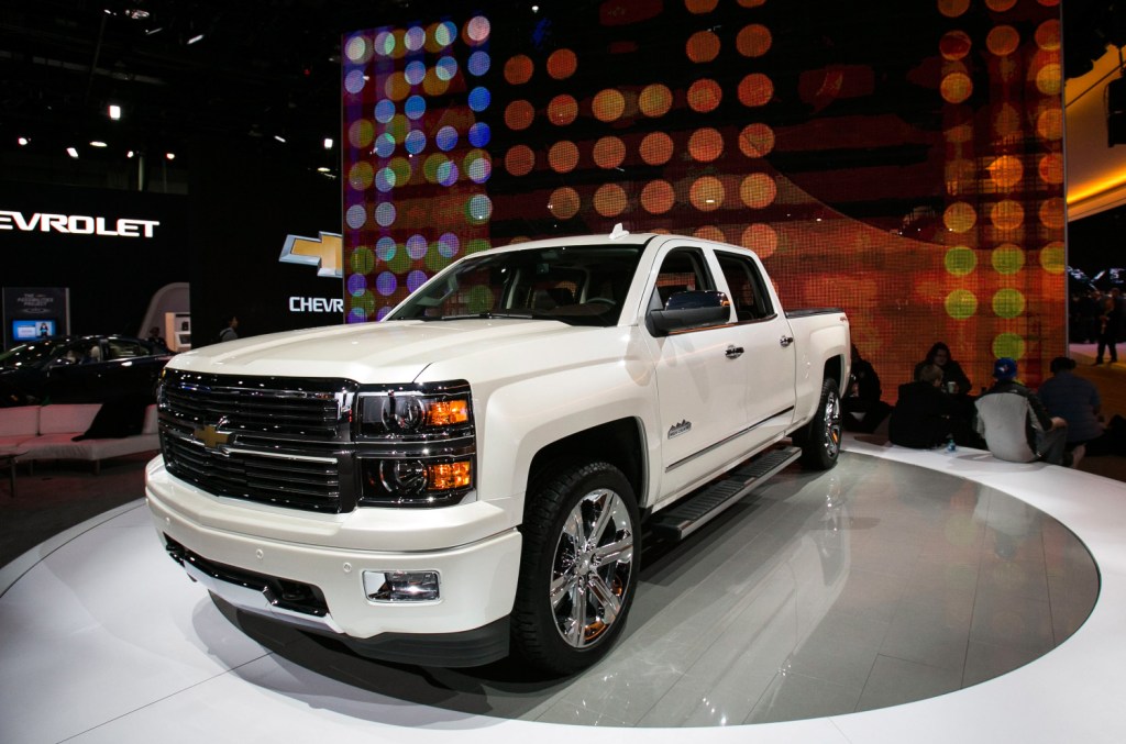 A white 2015 Chevrolet Silverado sits on display at the North American International Auto Show