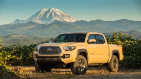 2016 Toyota Tacoma parked in front of a mountain