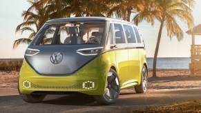 The yellow-and-silver 2017 Volkswagen ID.Buzz Concept parked by a sandy beach