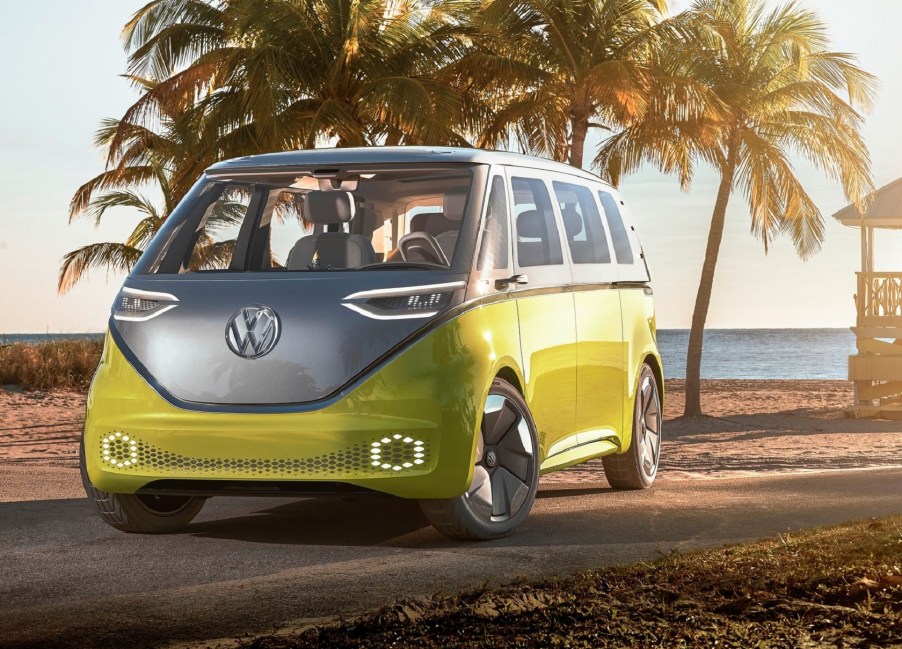 The yellow-and-silver 2017 Volkswagen ID.Buzz Concept parked by a sandy beach