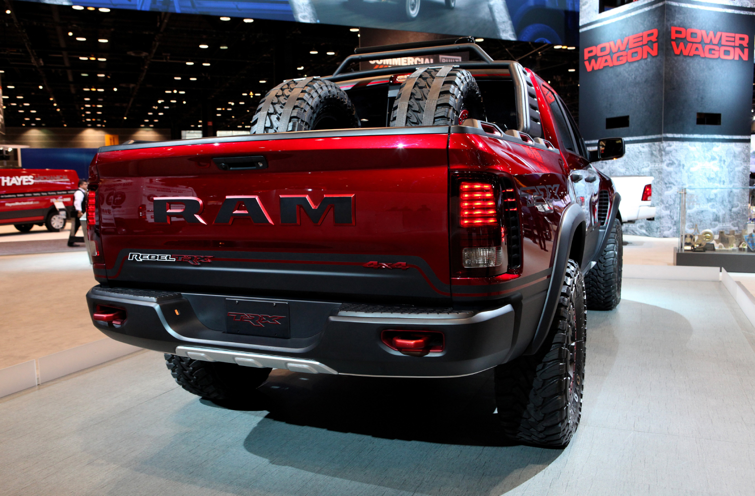 A red 2017 Ram 1500 Rebel TRX 4x4 on display with tires in the trunk