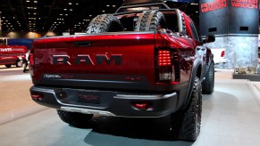 A red 2017 Ram 1500 Rebel TRX 4x4 on display with tires in the trunk
