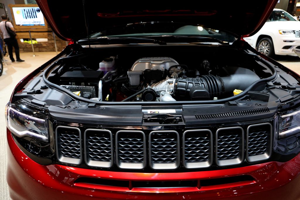 Under the hood of a red 2018 Jeep Grand Cherokee