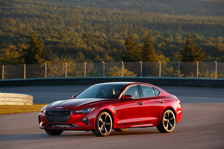 A red 2019 Genesis G70 sports sedan parked on the road course at Club Motorsports in Tamworth, New Hampshire, in July 2019
