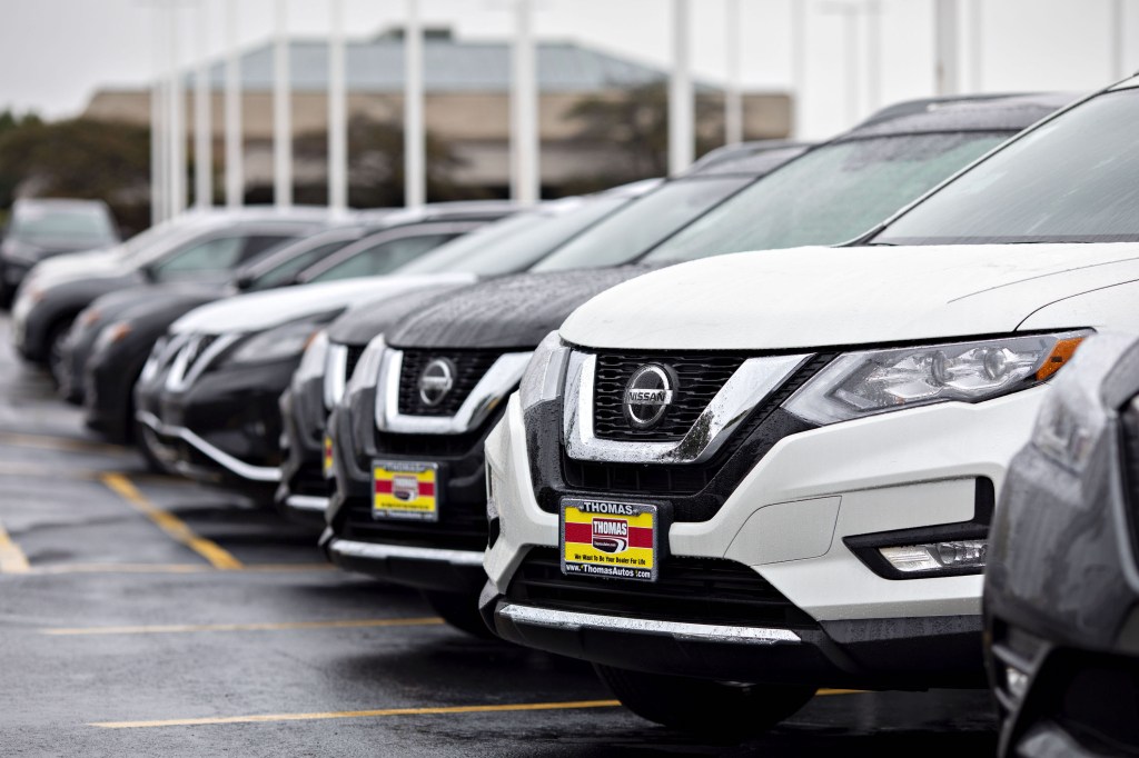 A 2019 Nissan Motor Co. Rogue sport utility vehicle (SUV) sits on the lot at a car dealership in Joliet, Illinois