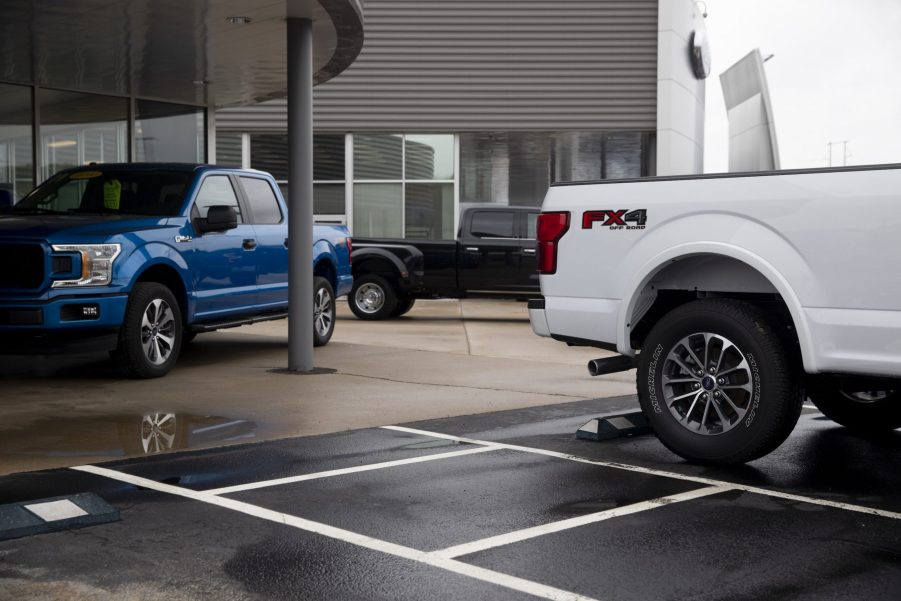 2020 Ford Motor Co. F-150 trucks sit outside the showroom at a car dealership in Peoria, Illinois, U.S.