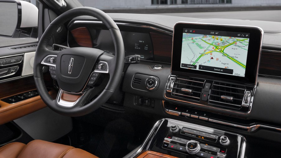 A 2020 Lincoln Navigator Reserve SUV's steering wheel and center stack with a large infotainment touchscreen