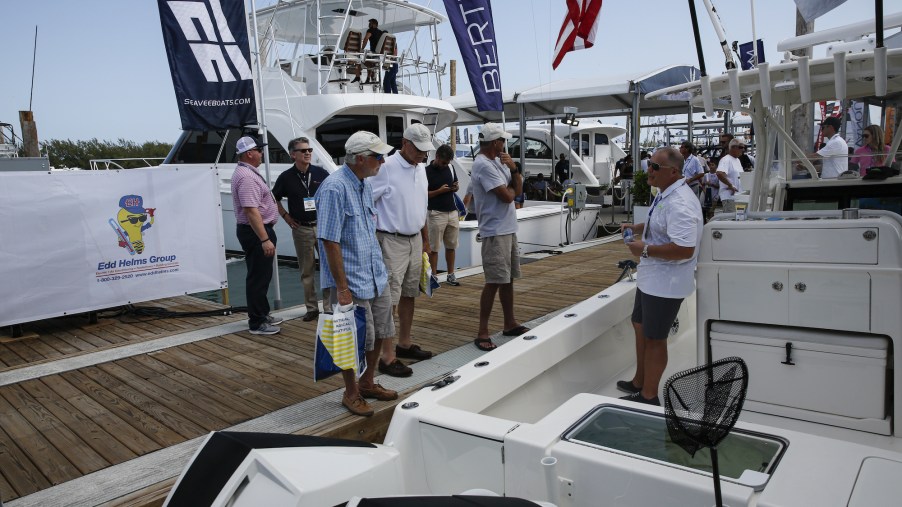 People view yachts during the Miami International Boat Show in Miami, Florida, on February 14, 2020.