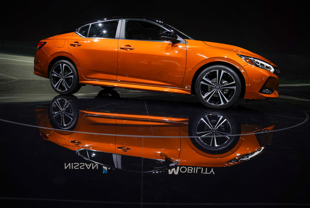 An orange 2020 Nissan Sentra sits on display
