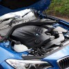 Under the hood of a blue 2021 BMW 2 Series Coupé