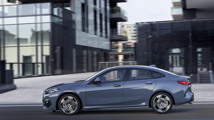 A grey 2021 BMW 2 Series Gran Coupe driving on a city street
