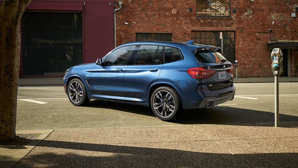 a rear shot of a blue 2021 BMW X3
