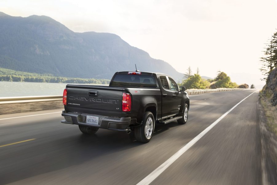 A black 2021 Chevy Colorado Diesel LT driving down a highway road