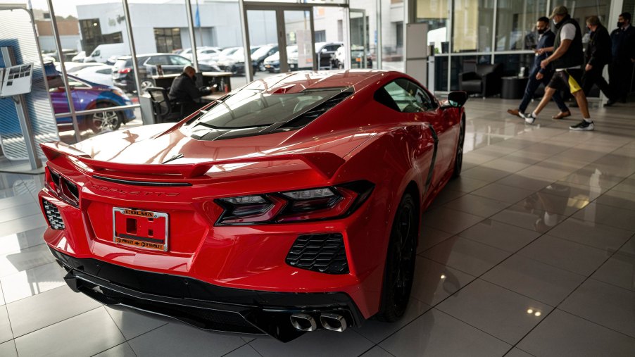 A red 2021 Chevy Corvette sports car parked inside a car dealership in Colma, California, on Monday, February 8, 2021