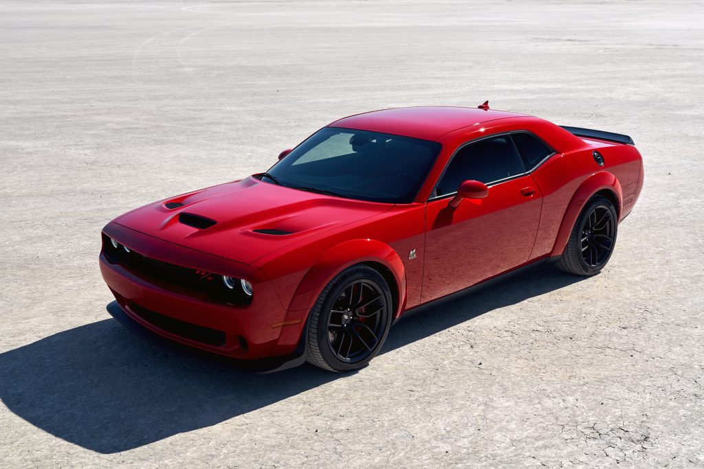 A red 2021 Dodge Challenger R/T Scat Pack Widebody parked on display