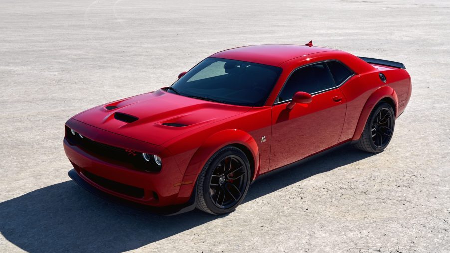 A red 2021 Dodge Challenger R/T Scat Pack Widebody parked on display