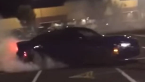 2021 Dodge Charger Hellcat Widebody Redeye doing donuts in parking lot