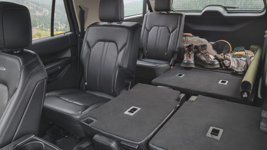 A 2021 Ford Expedition Platinum full-size SUV's black-leather rear seating and cargo space