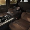 A 2021 Ford F-150 King Ranch pickup truck's tan front seats reclined flat