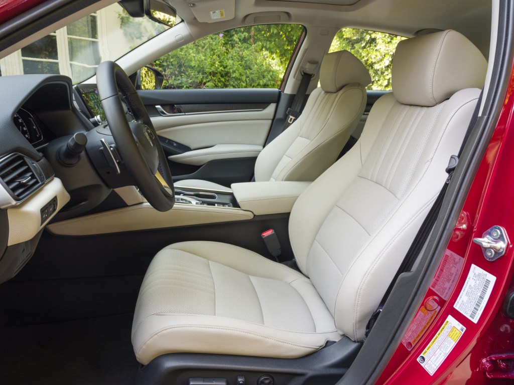 A look at the white leather seats inside of a red 2021 Honda Accord Hybrid
