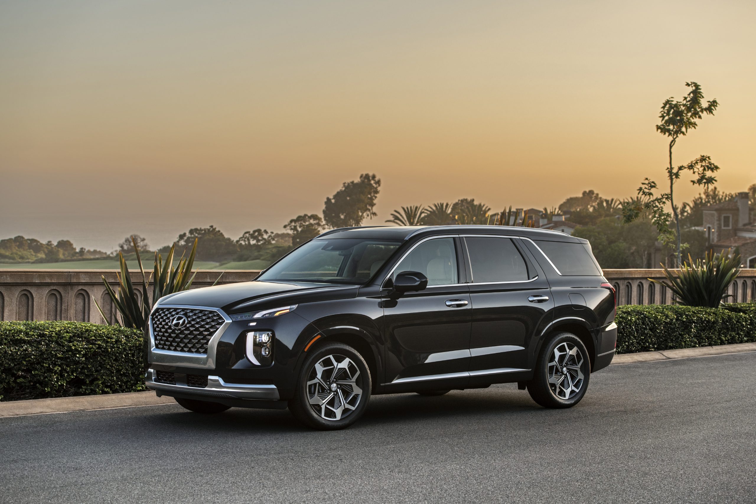 2021 Hyundai Palisade Calligraphy parked on display with a dusk sky in the background