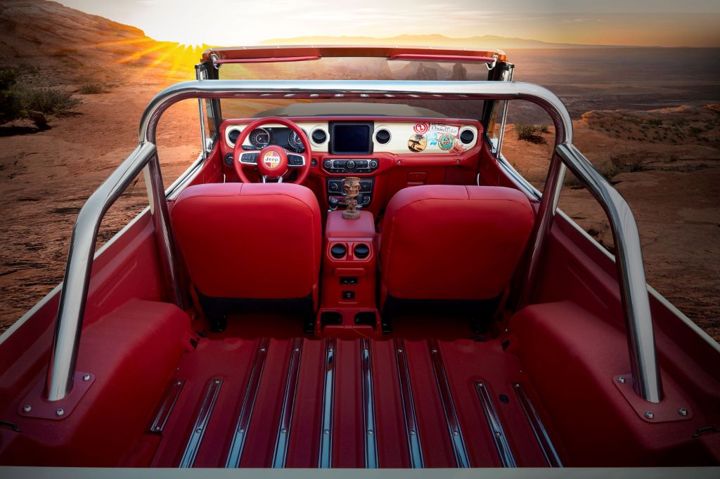 The rear view of the 2021 Jeep Jeepster Beach conept's chrome roll cage and red-leather interior