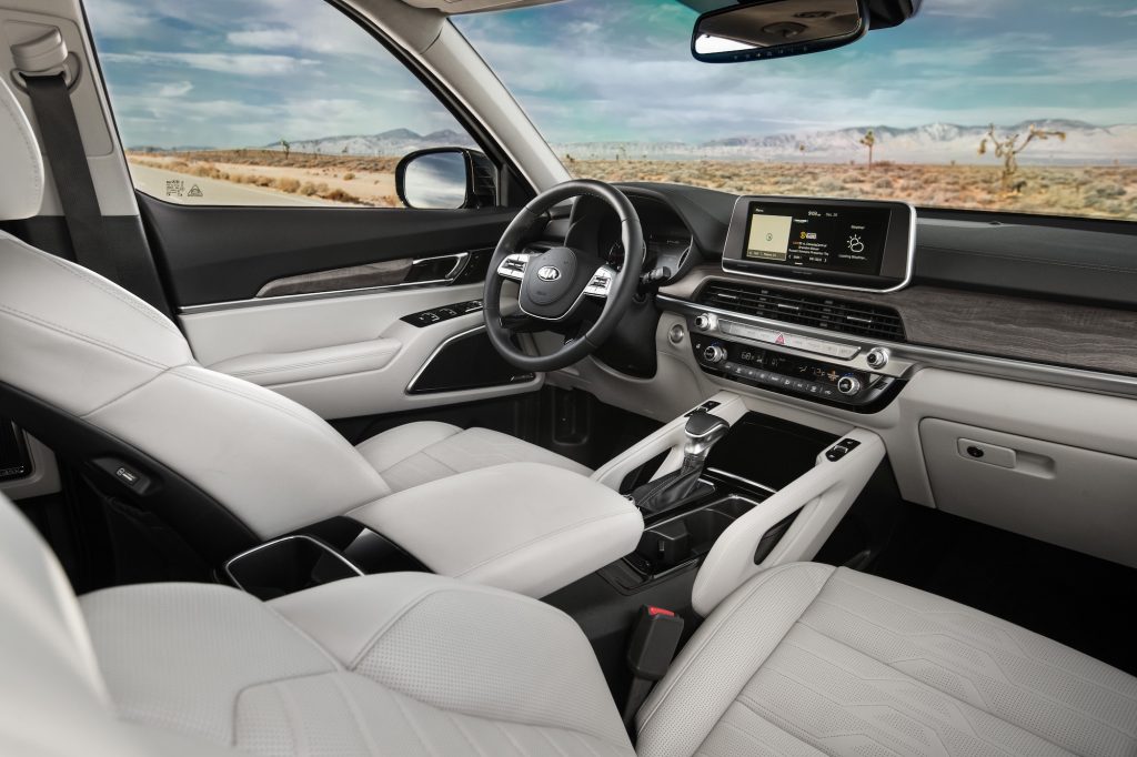 An interior view of a 2021 Kia Telluride front seats and dashboard adds to the comfort of this SUV.
