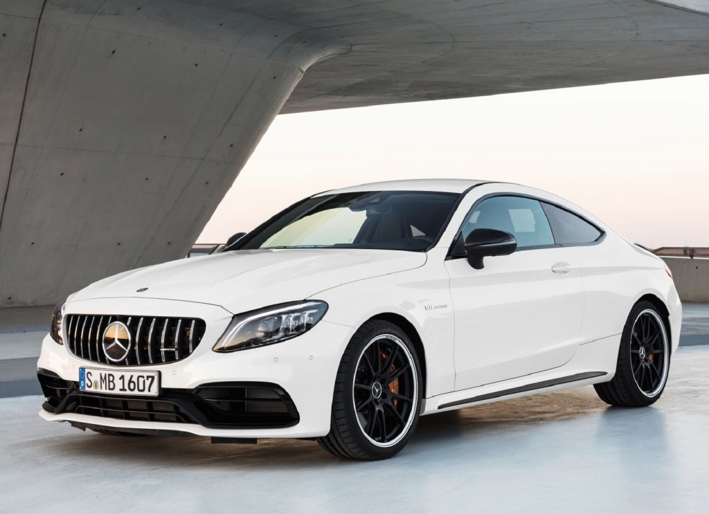 A white 2021 Mercedes-AMG C 63 S Coupe underneath a concrete structure