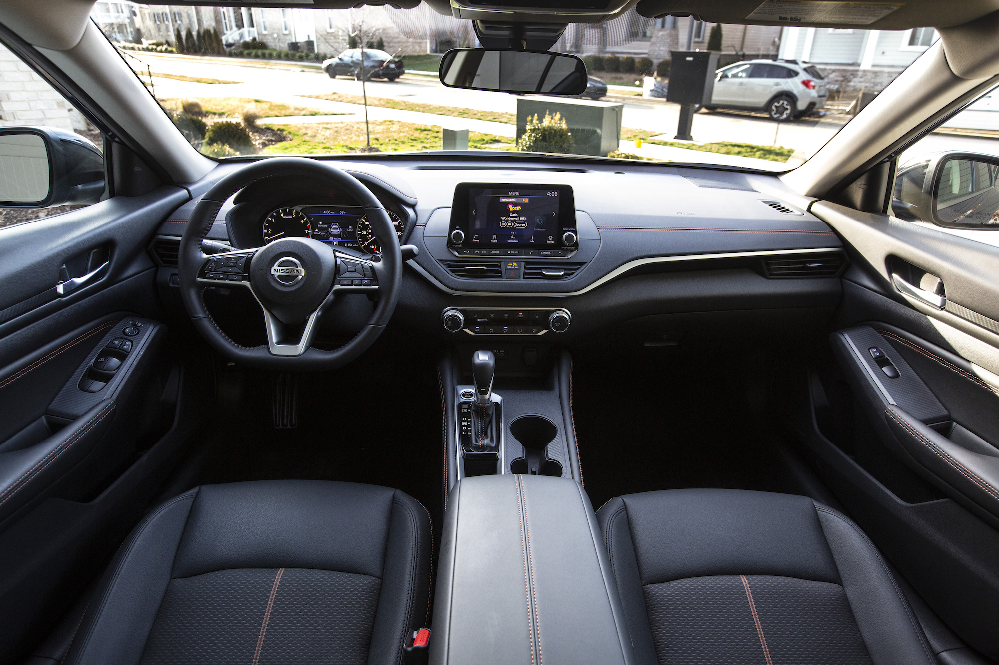 A 2021 Nissan Altima midsize sedan's front seats, center console, and dashboard